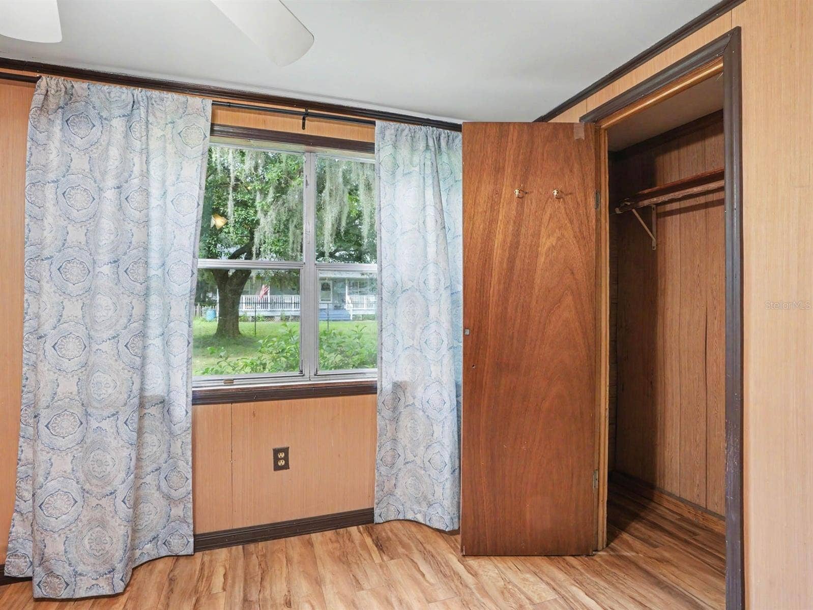 3015 STRAWBERRY LANE, Lakeland, FL 33801 Bedroom with Wood Closet, Window Treatments & Access to Outdoor Spaces