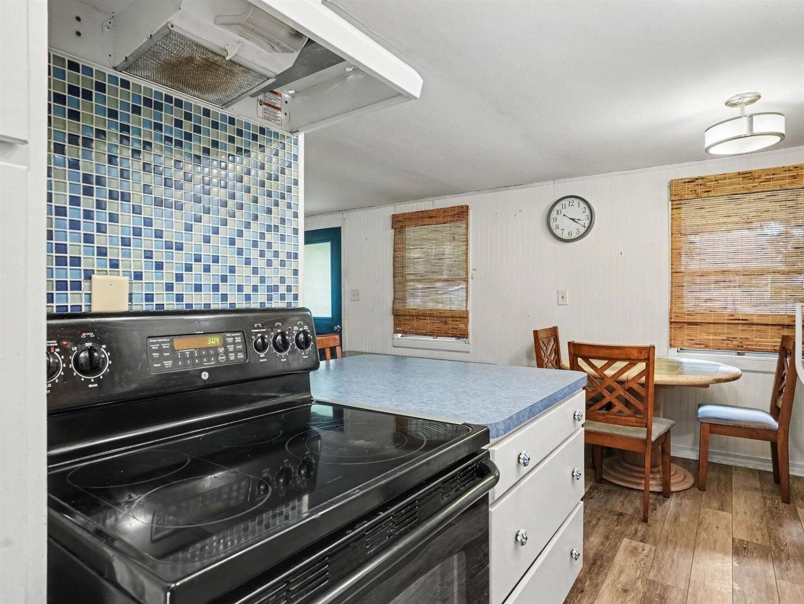 3015 STRAWBERRY LANE, Lakeland, FL 33801 Spacious Kitchen with Double Oven, Blue Tile Accents & Breakfast Dining Area