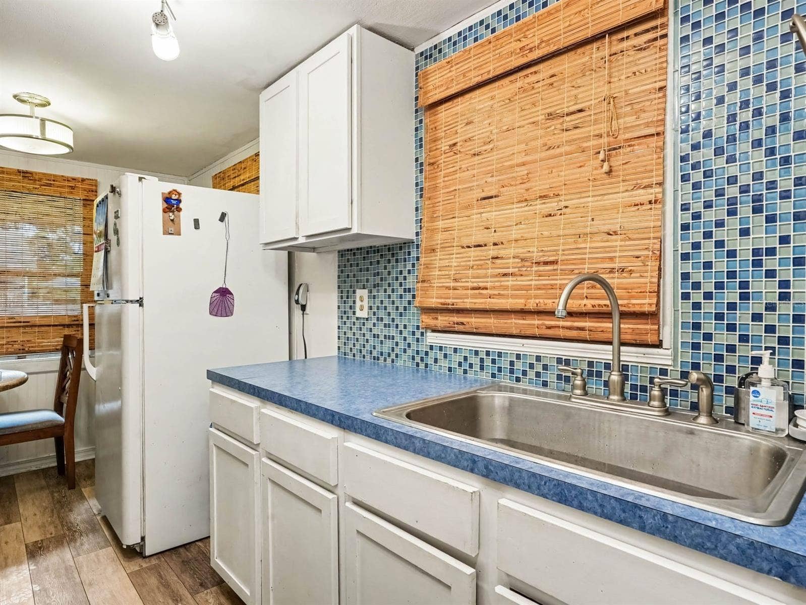 3015 STRAWBERRY LANE, Lakeland, FL 33801 Updated Kitchen with Blue Tile Backsplash, Stainless Steel Sink & Modern Appliances