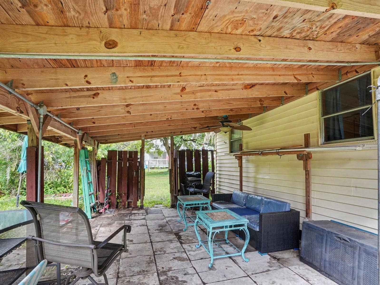 3015 STRAWBERRY LANE, Lakeland, FL 33801 Covered Patio with Wooden Beams & Ample Seating Area