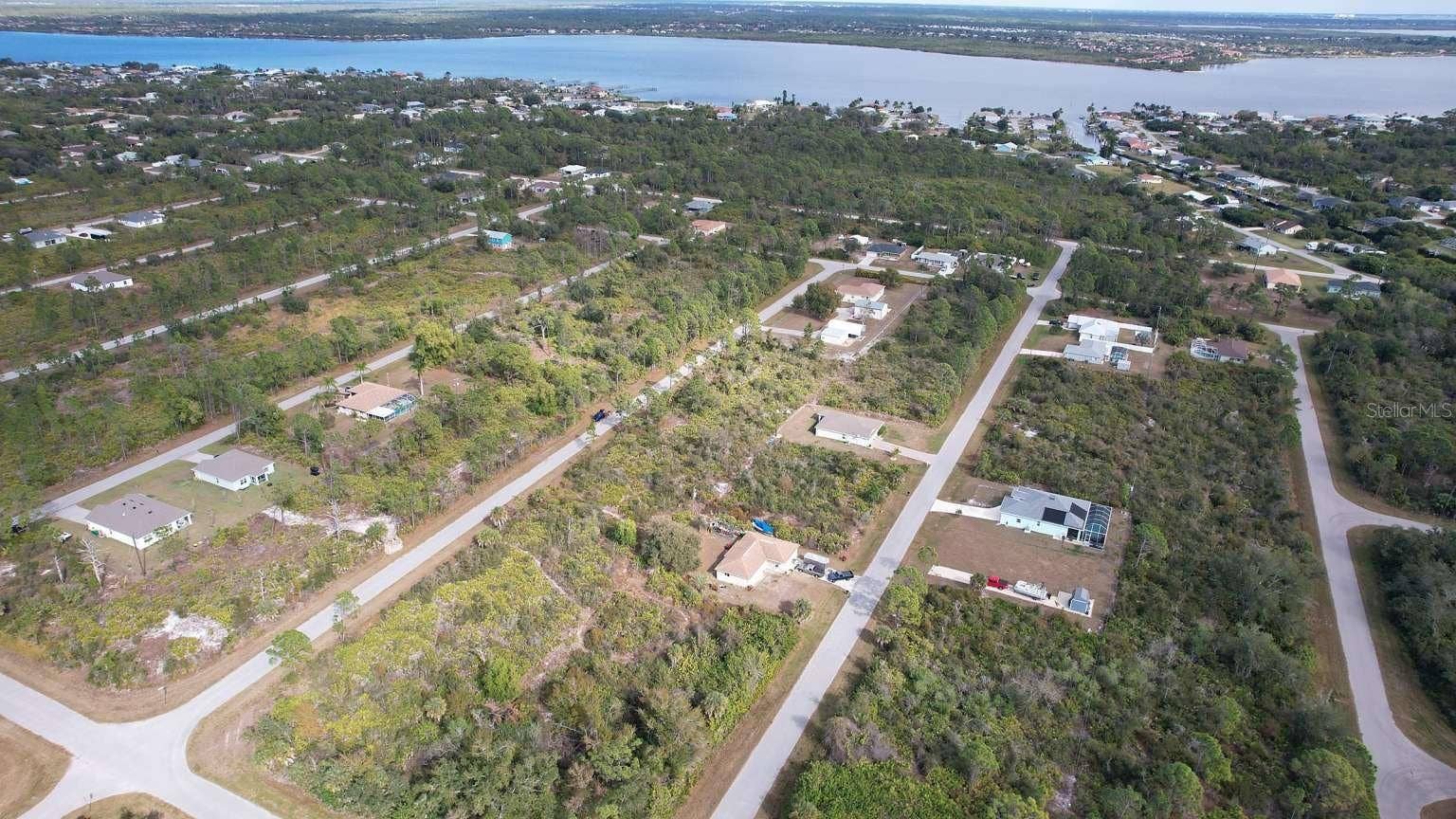 12181 CONROY AVENUE, Port Charlotte, FL 33981 Aerial view of the surrounding area; nearby water features are not part of this property and do not establish access rights.
