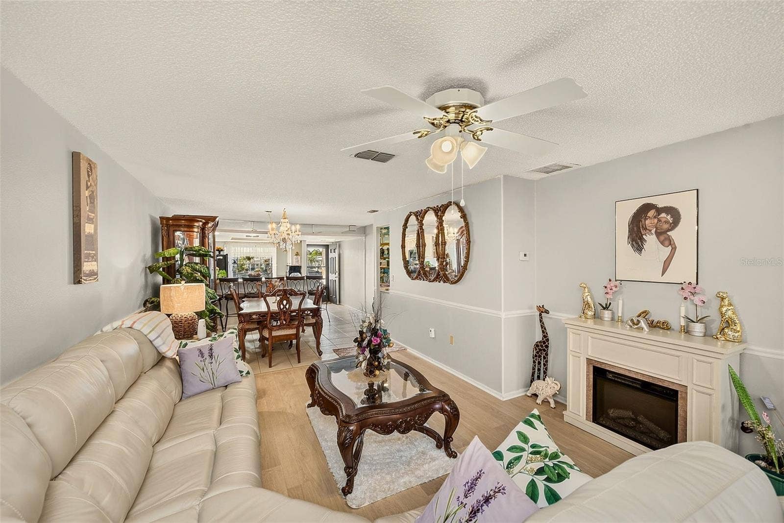 19029 US HIGHWAY 19 N, #21F, Clearwater, FL 33764 View of living room, dining room and kitchen