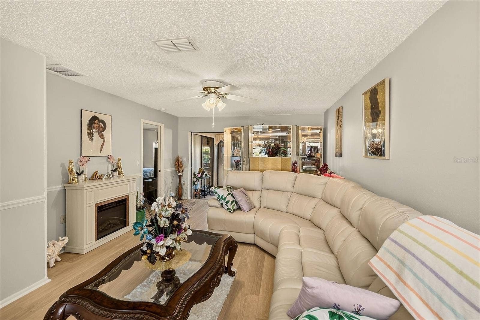 19029 US HIGHWAY 19 N, #21F, Clearwater, FL 33764 View of living room with fireplace