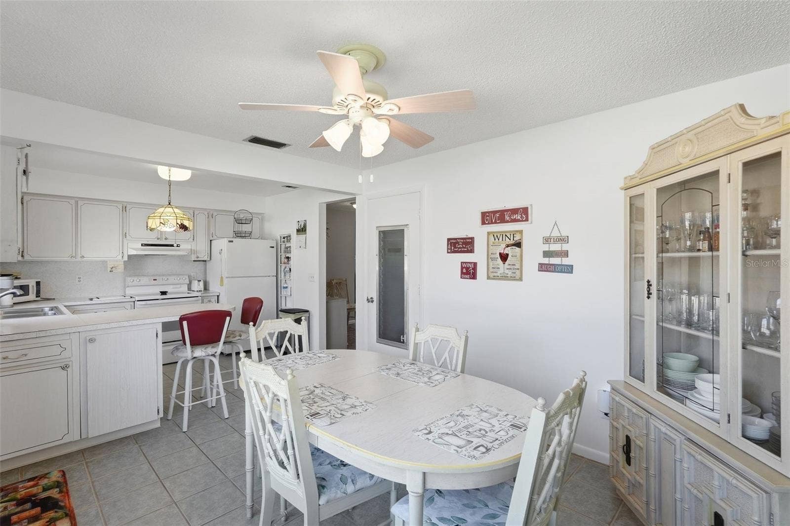 7035 MONTE CARLO N, Pinellas Park, FL 33781 Additional view of the dining area with abundant natural light.