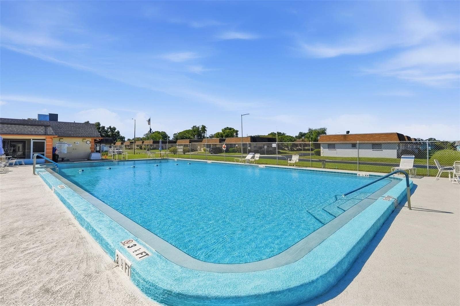 7035 MONTE CARLO N, Pinellas Park, FL 33781 Enjoy the Florida sunshine at the community swimming pool.