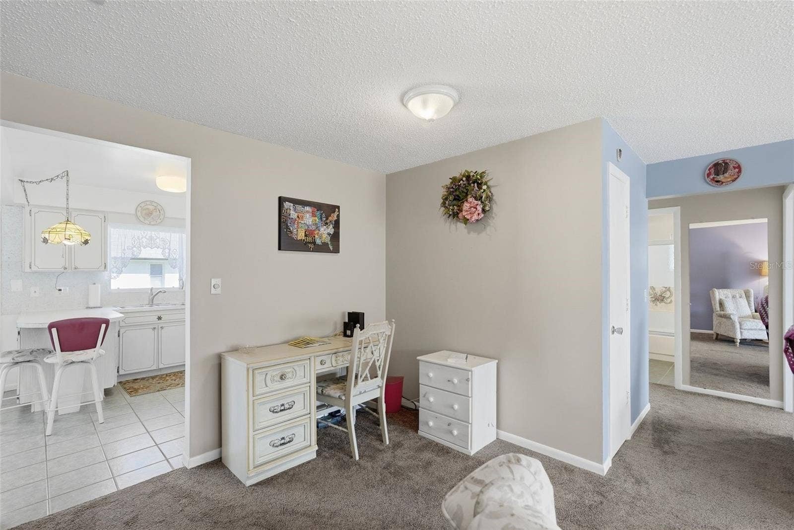 7035 MONTE CARLO N, Pinellas Park, FL 33781 Living Room and entry ways to kitchen and bedrooms/bathrooms.
