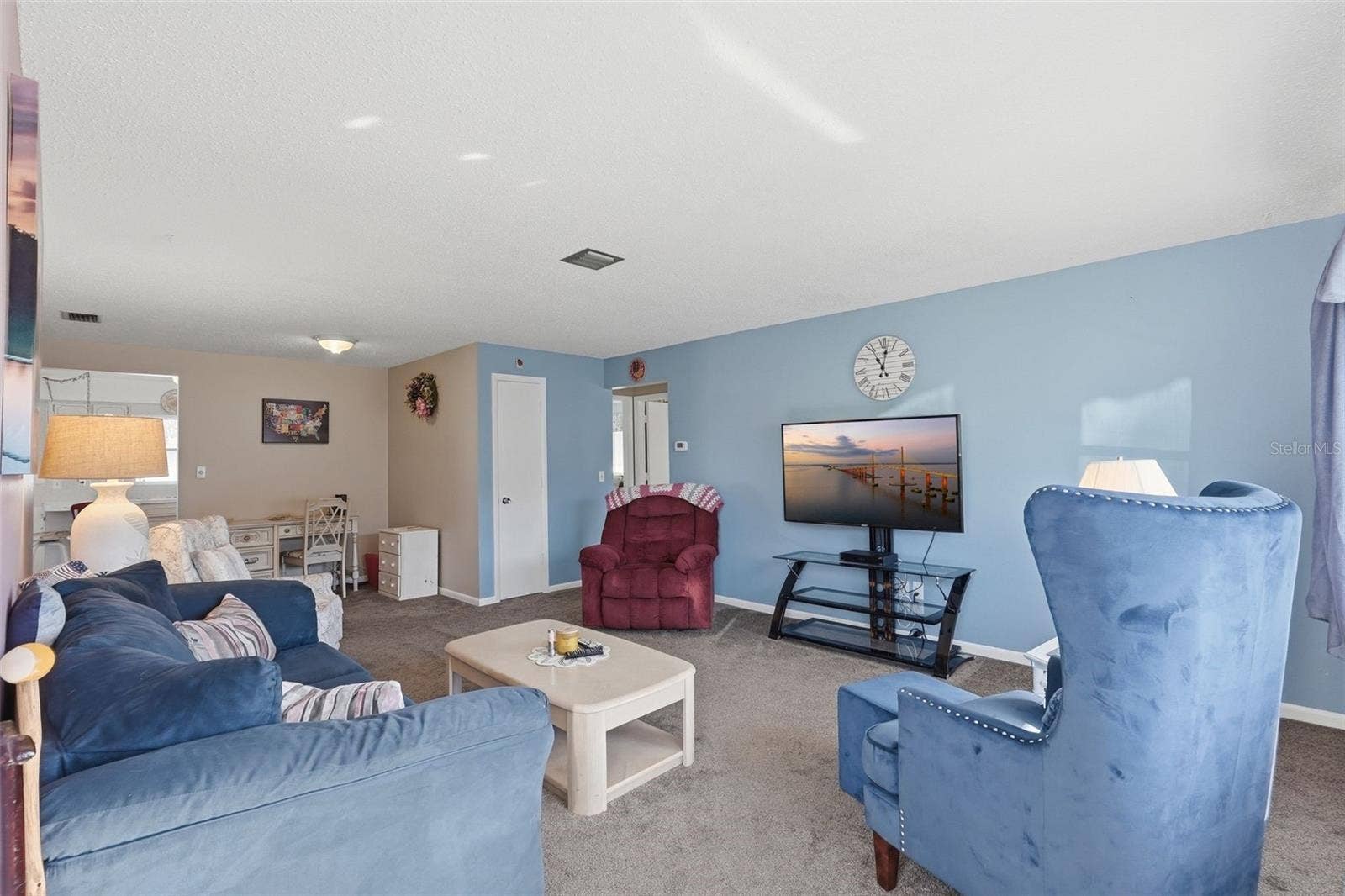 7035 MONTE CARLO N, Pinellas Park, FL 33781 Spacious living room with comfortable seating and an open, inviting layout.