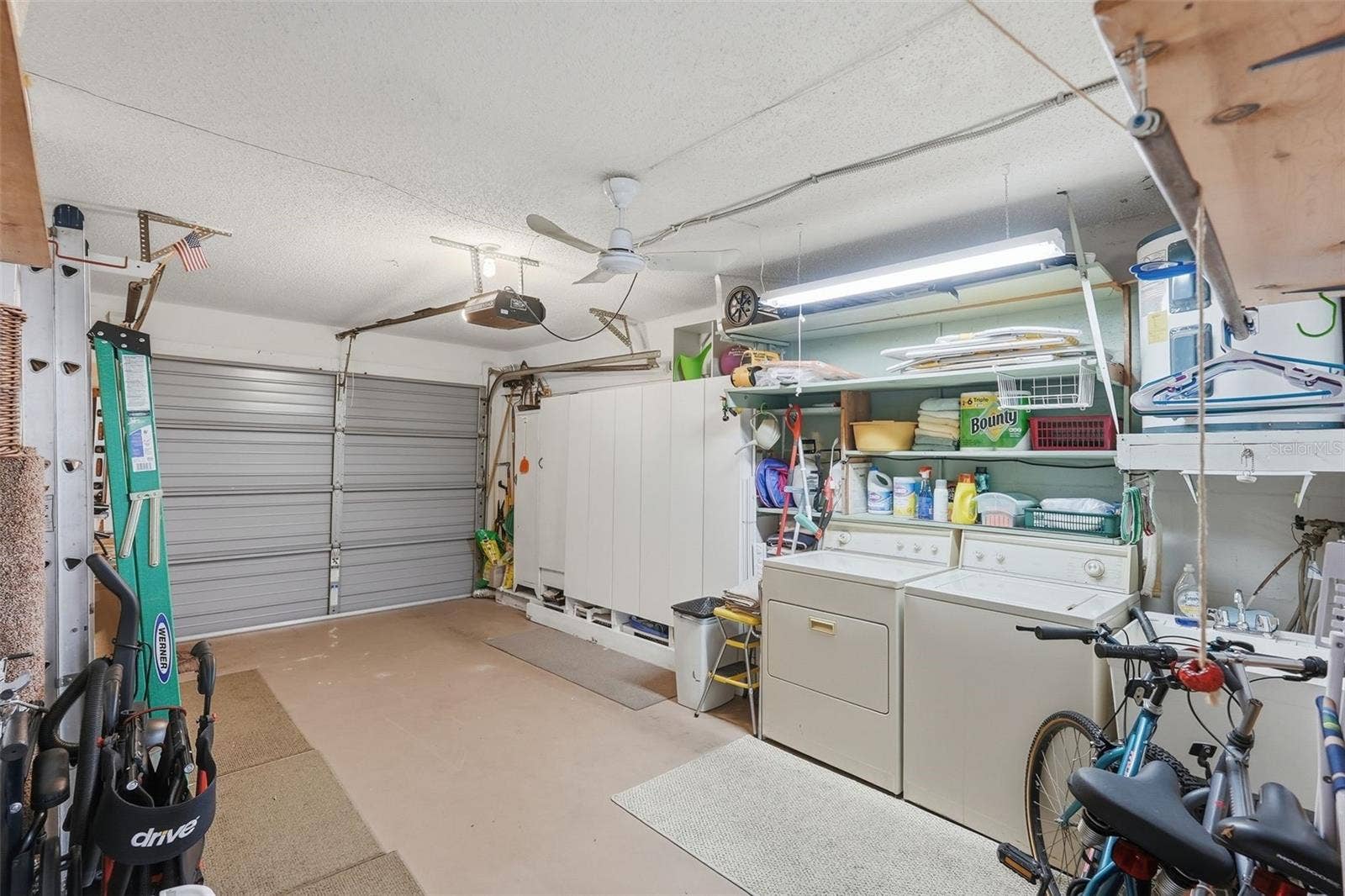7035 MONTE CARLO N, Pinellas Park, FL 33781 Additional garage view showing room for storage and household essentials.