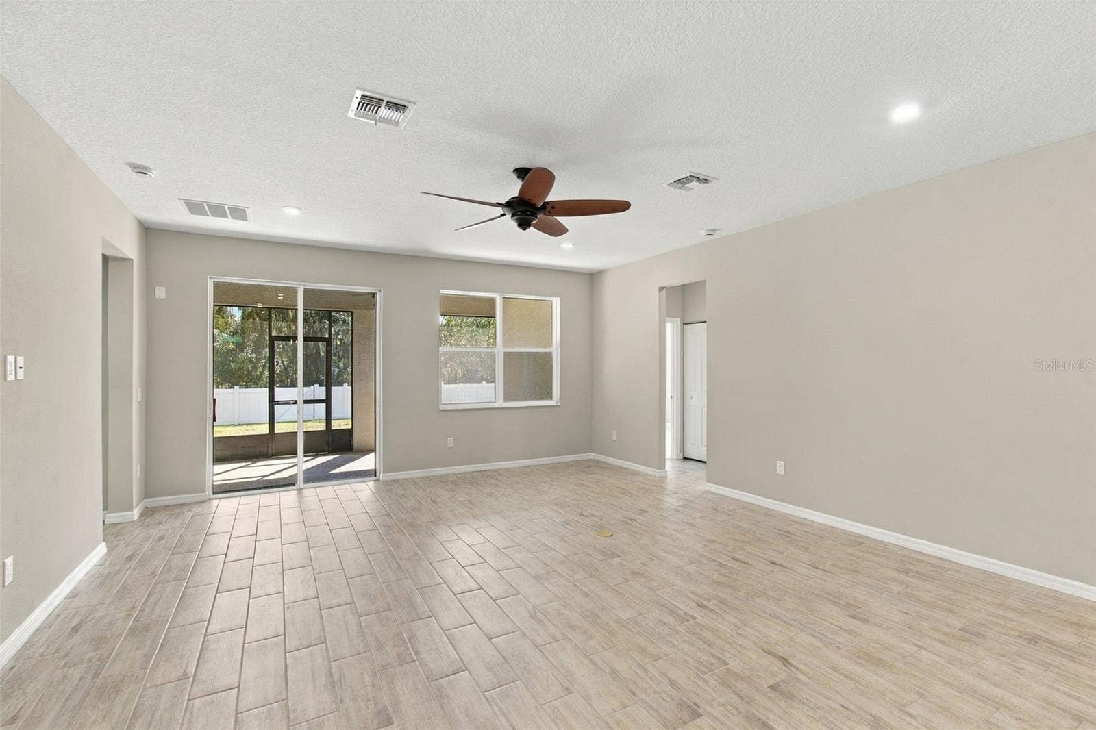 12417 BRICK COBBLESTONE DRIVE, Riverview, FL 33579 Return to Living Room, facing patio and backyard, heading towards Bedrooms to the right