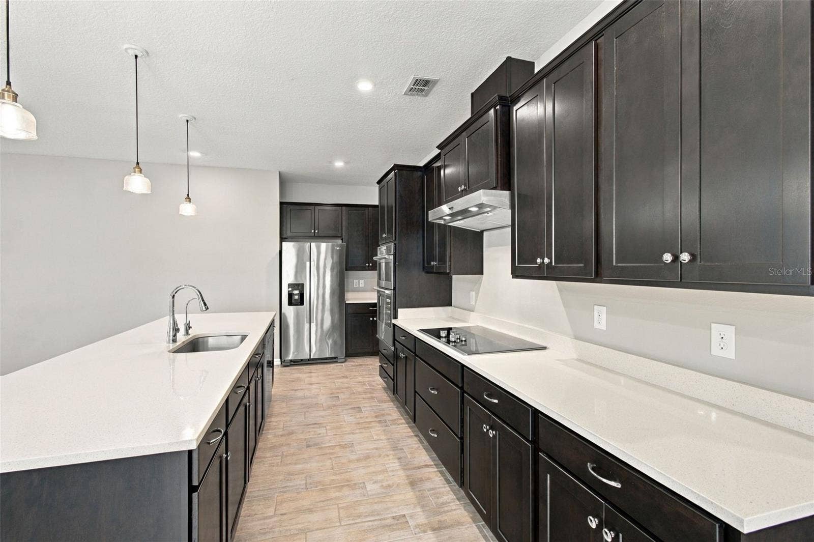 12417 BRICK COBBLESTONE DRIVE, Riverview, FL 33579 Massive center island in the kitchen - sink has its own Reverse Osmosis tap: the champagne of drinking water!