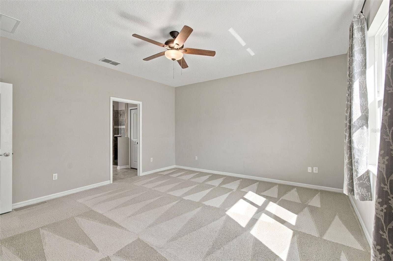 12417 BRICK COBBLESTONE DRIVE, Riverview, FL 33579 Primary bedroom with ceiling fan