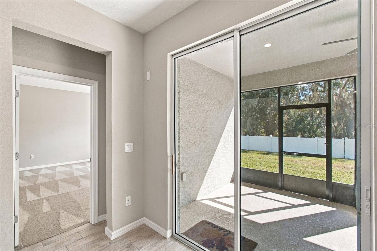 12417 BRICK COBBLESTONE DRIVE, Riverview, FL 33579 Primary Suite entrance to left, screened in patio to right