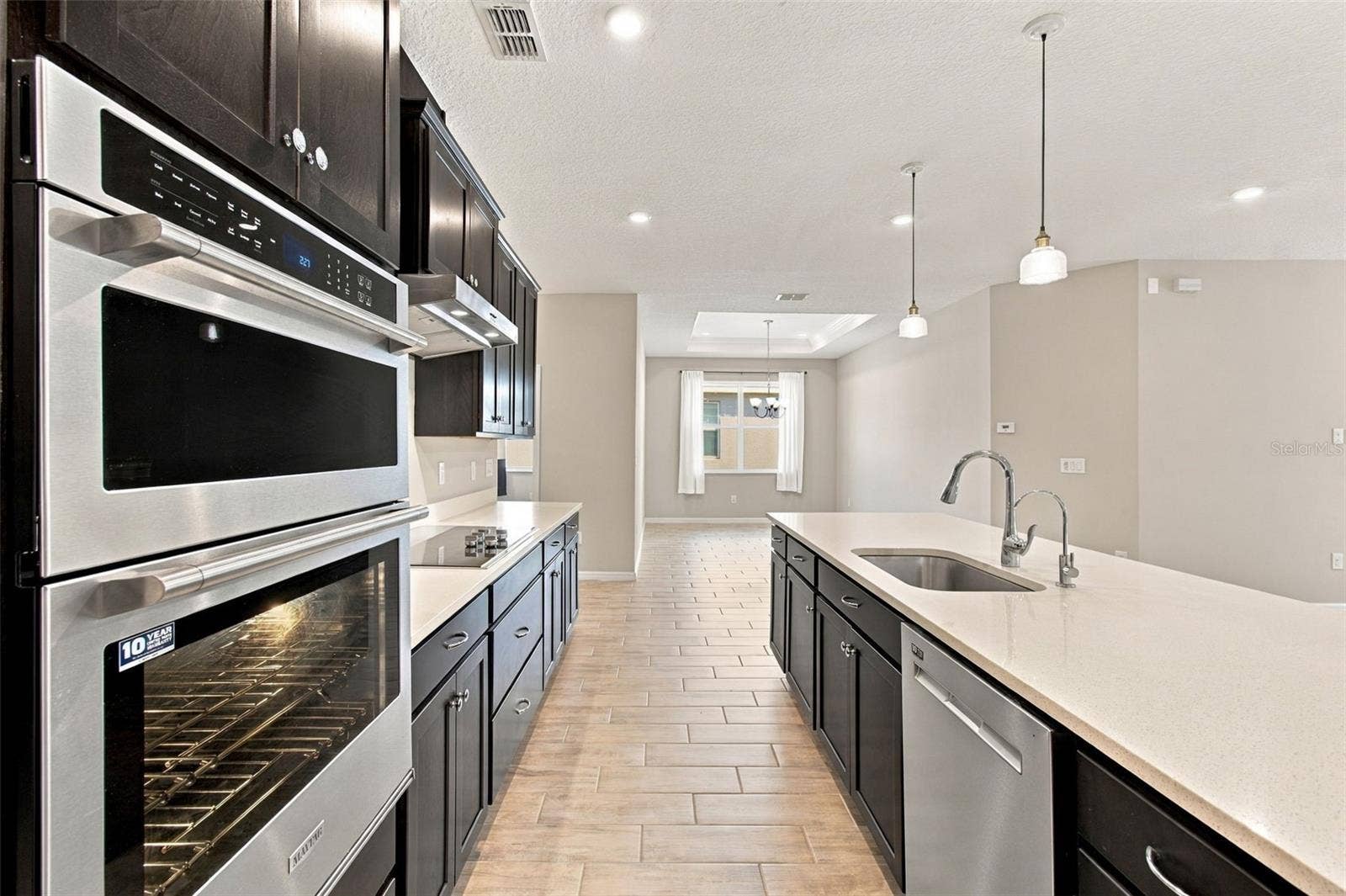 12417 BRICK COBBLESTONE DRIVE, Riverview, FL 33579 Kitchen with Maytag and Whirlpool stainless steel appliances