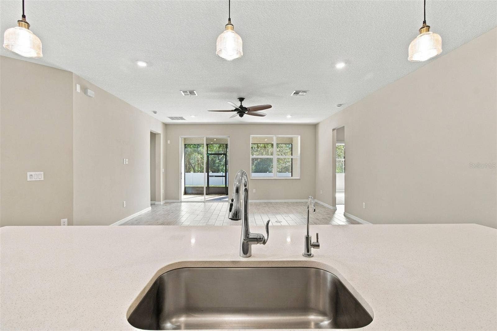 12417 BRICK COBBLESTONE DRIVE, Riverview, FL 33579 View from kitchen island - deep stainless steel sink has a dedicated Reverse Osmosis drinking water tap!