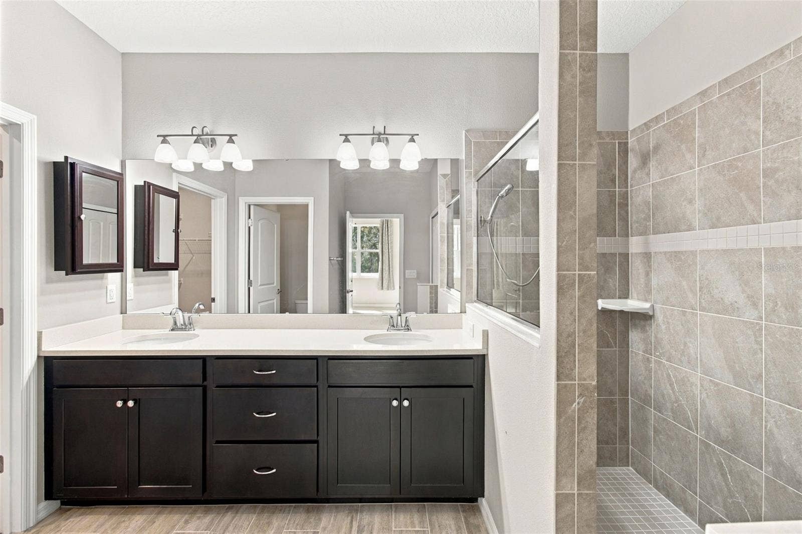 12417 BRICK COBBLESTONE DRIVE, Riverview, FL 33579 Double sink large vanity with quartz counters and tiled walk-in shower