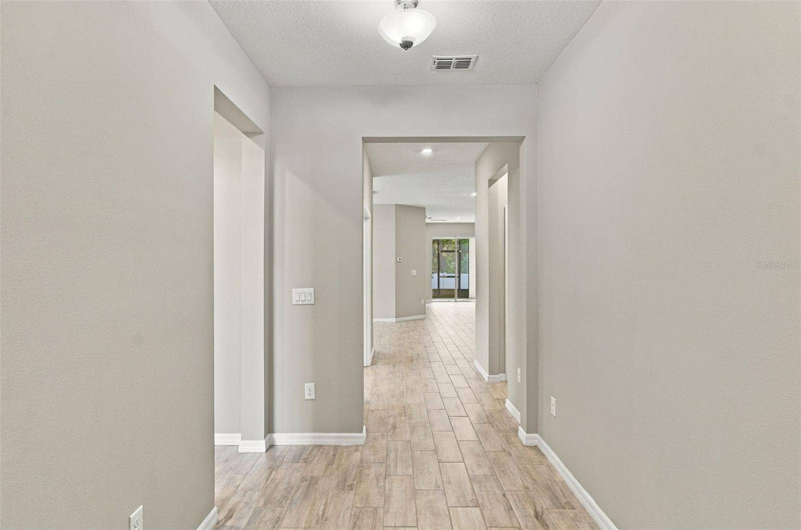 12417 BRICK COBBLESTONE DRIVE, Riverview, FL 33579 Hallway leaving guest suite and heading to office