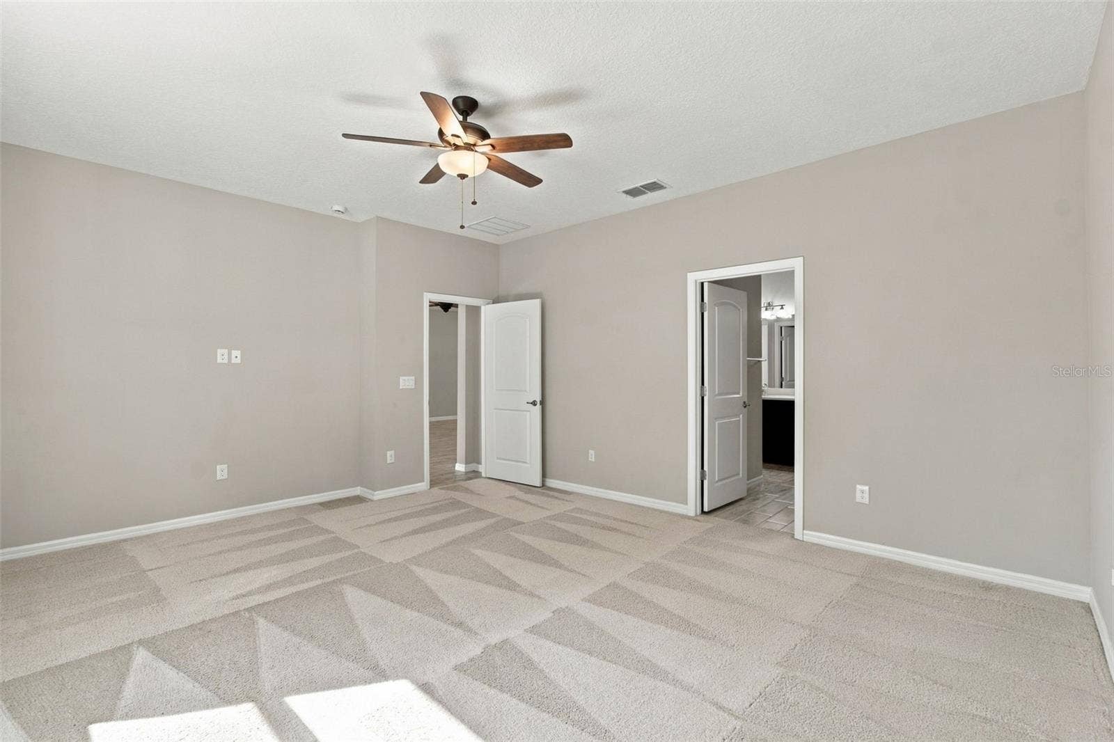 12417 BRICK COBBLESTONE DRIVE, Riverview, FL 33579 Primary bedroom with ceiling fan