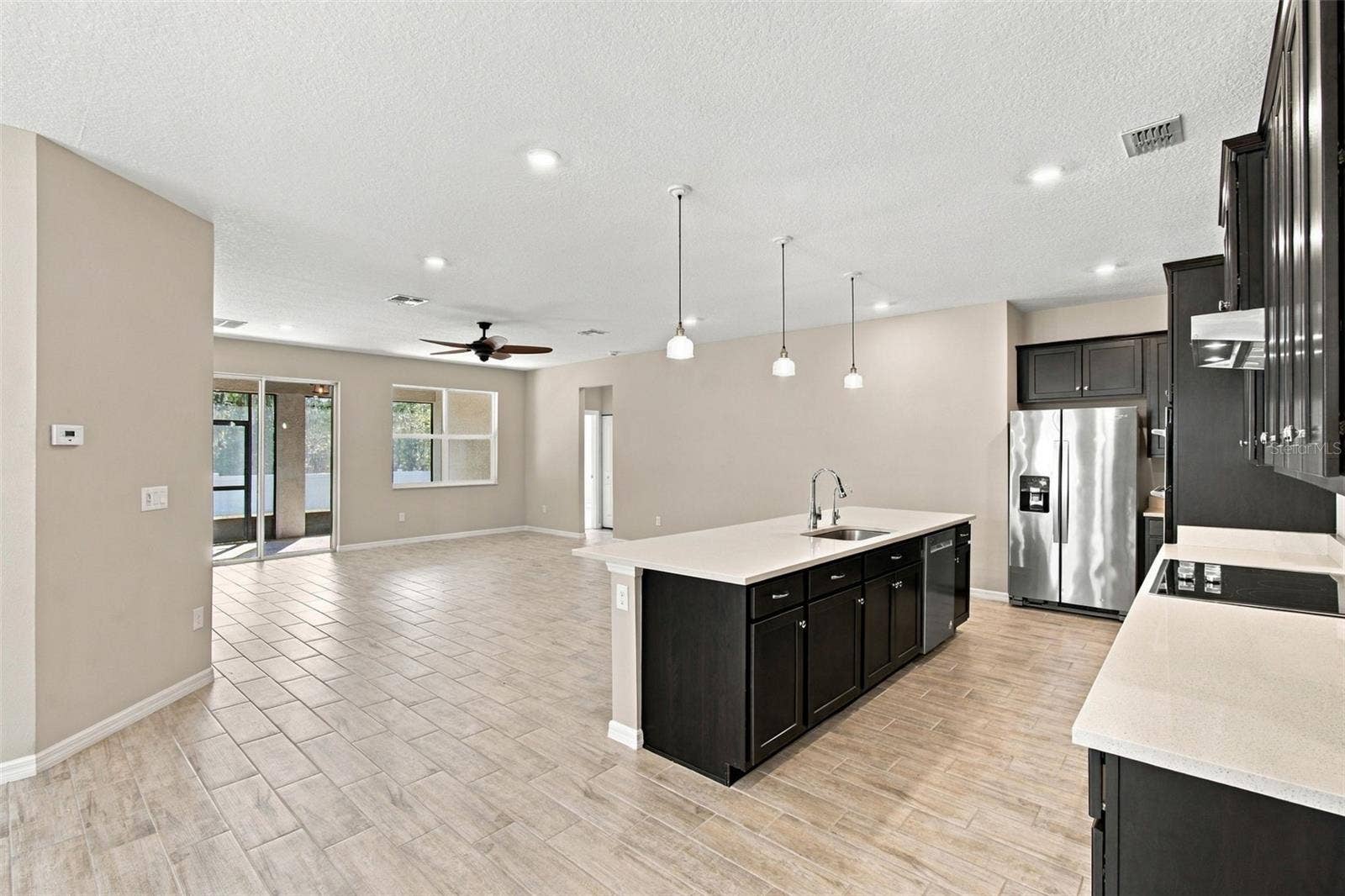 12417 BRICK COBBLESTONE DRIVE, Riverview, FL 33579 Kitchen and Living Room views