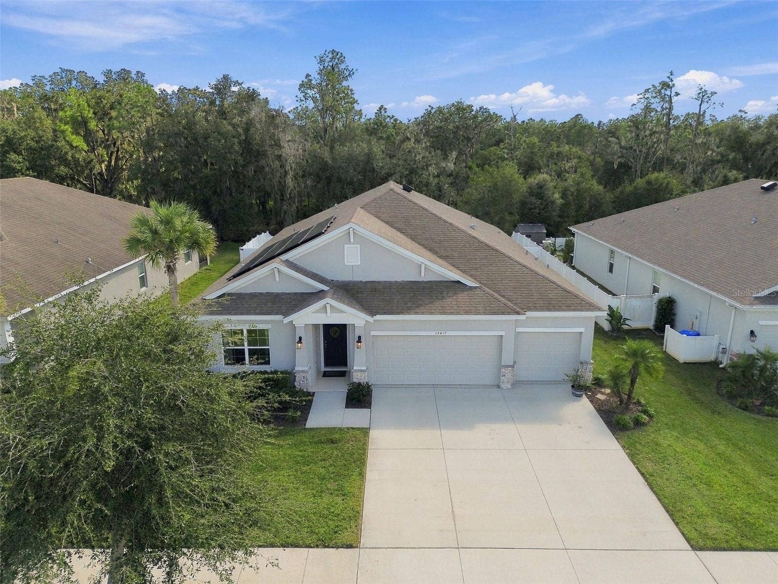 12417 BRICK COBBLESTONE DRIVE, Riverview, FL 33579 Overhead view of home's front exterior with conservation in background