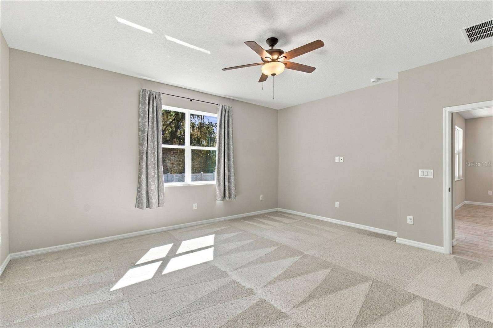 12417 BRICK COBBLESTONE DRIVE, Riverview, FL 33579 Primary bedroom with ceiling fan and conservation views