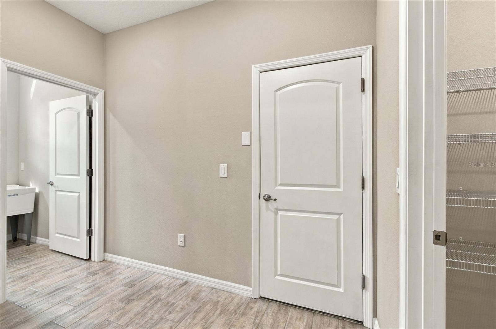 12417 BRICK COBBLESTONE DRIVE, Riverview, FL 33579 Mudroom area - Laundry to the left and Pantry to the right, Garage door straight ahead
