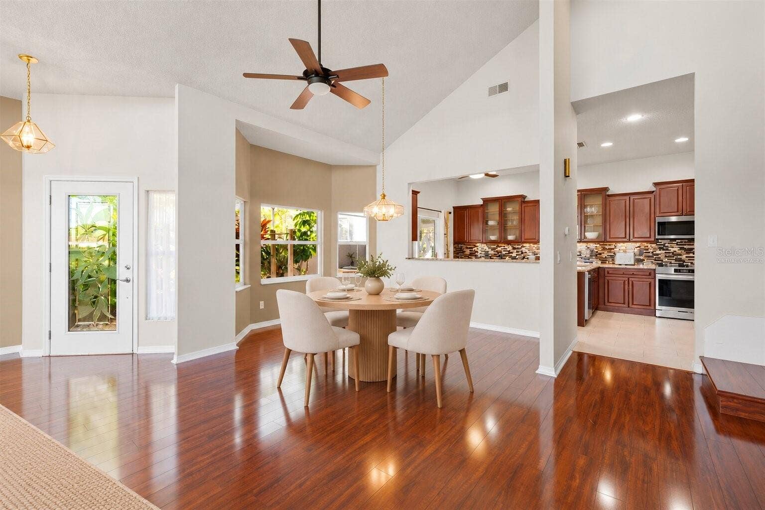759 MASTERPIECE DRIVE, Sun City Center, FL 33573 Virtually Staged - Dining Room and Kitchen