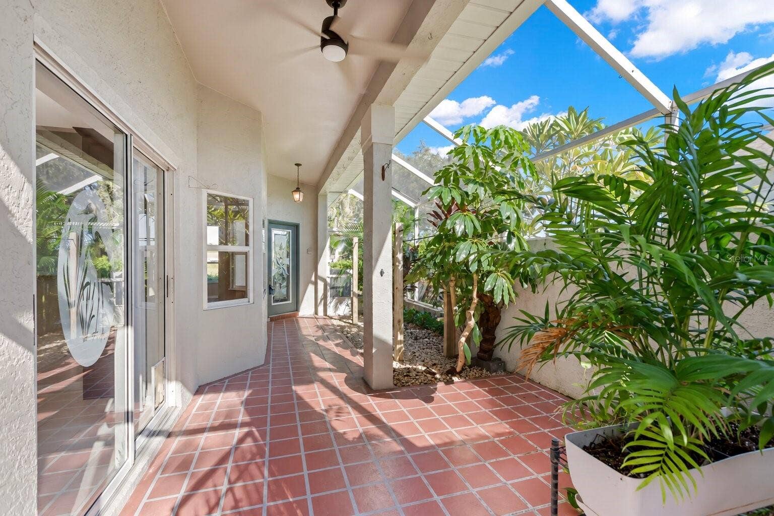 759 MASTERPIECE DRIVE, Sun City Center, FL 33573 Screened and covered entry.
