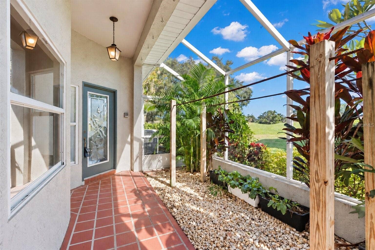 759 MASTERPIECE DRIVE, Sun City Center, FL 33573 Screened and covered entry.