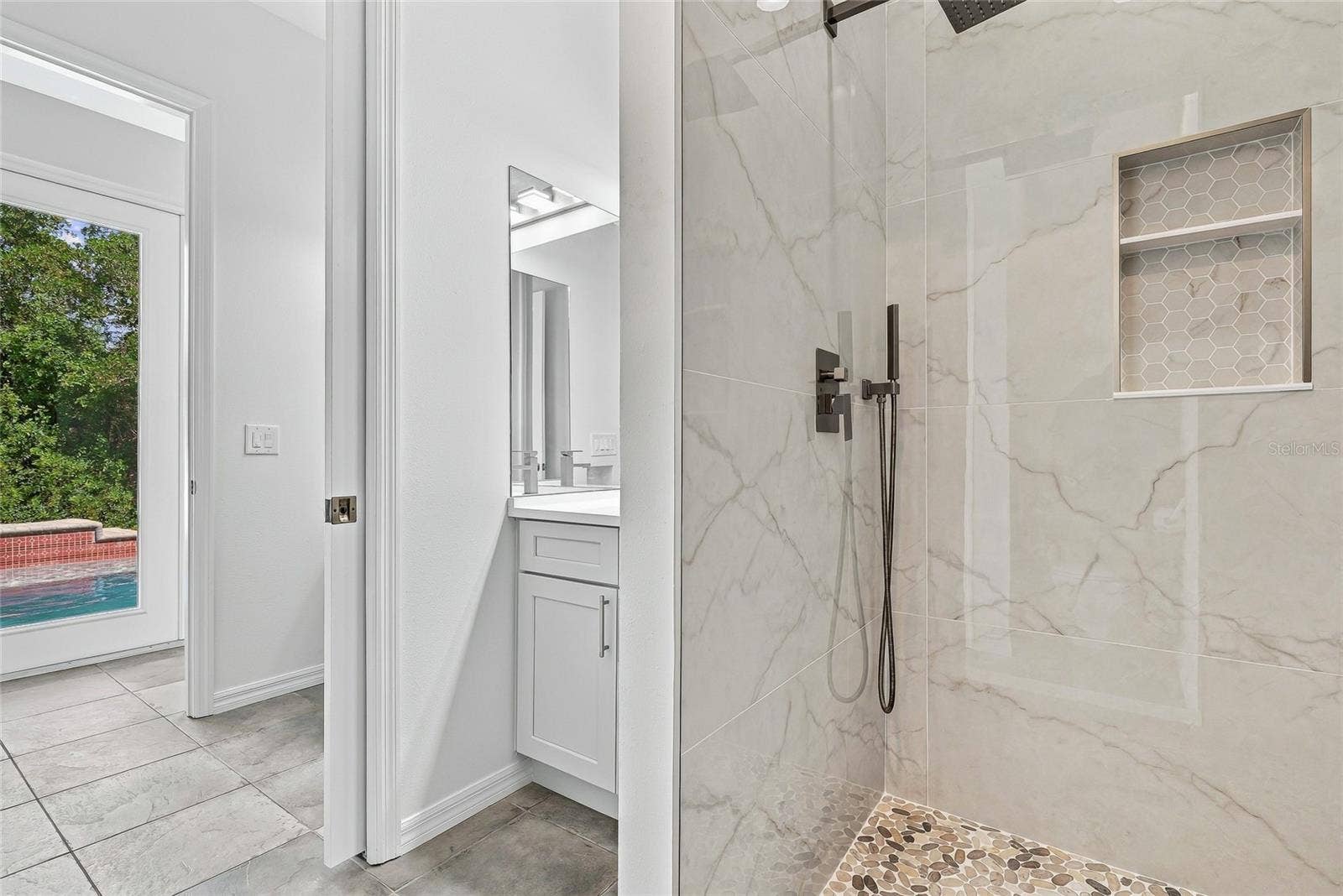 Full bath and half bath accessible by the pool.