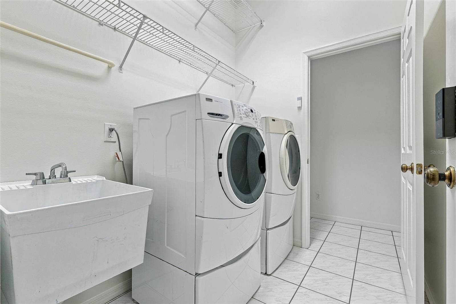 Interior laundry room and utility sink.