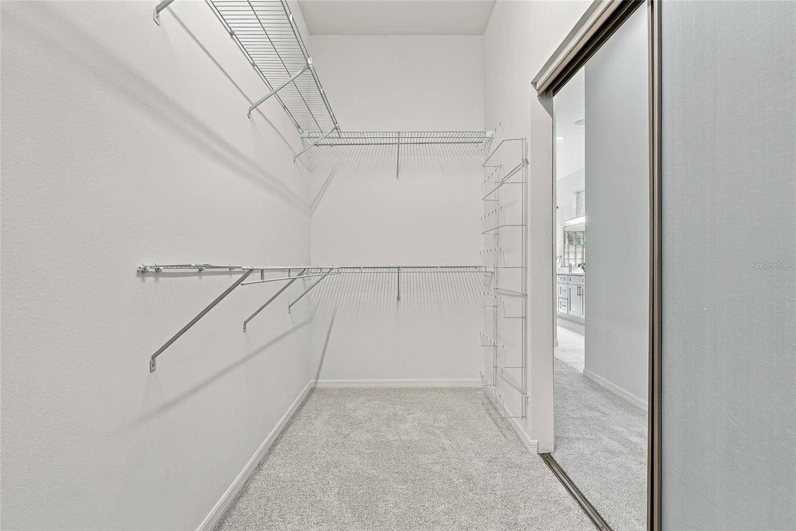 Two of two huge closets in the primary bedroom.