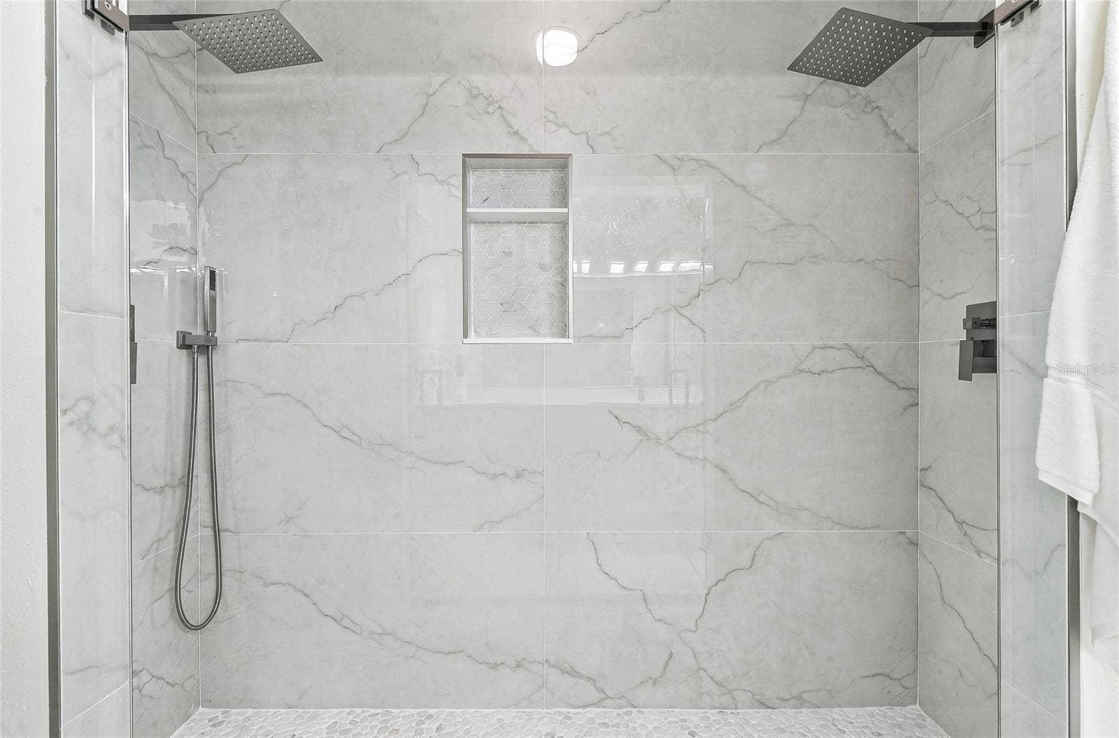 Dual rain shower heads in the primary bathroom.