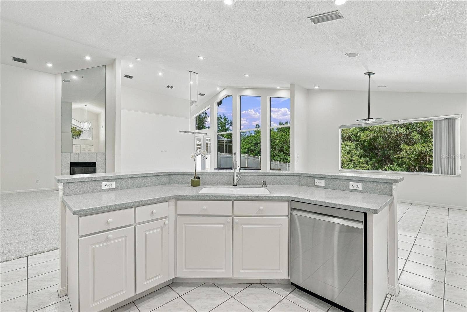 Open and spacious kitchen with breakfast bar for casual dining.
