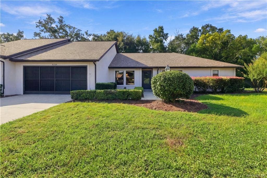 6268 W WESTON DRIVE, Crystal River, FL 34429 WELCOME HOME TO MEADOWCREST! CURB APPEAL THAT SHINES! Welcoming front elevation features a contrasting DARK GARAGE DOOR, covered entry & beautifully maintained landscaping!