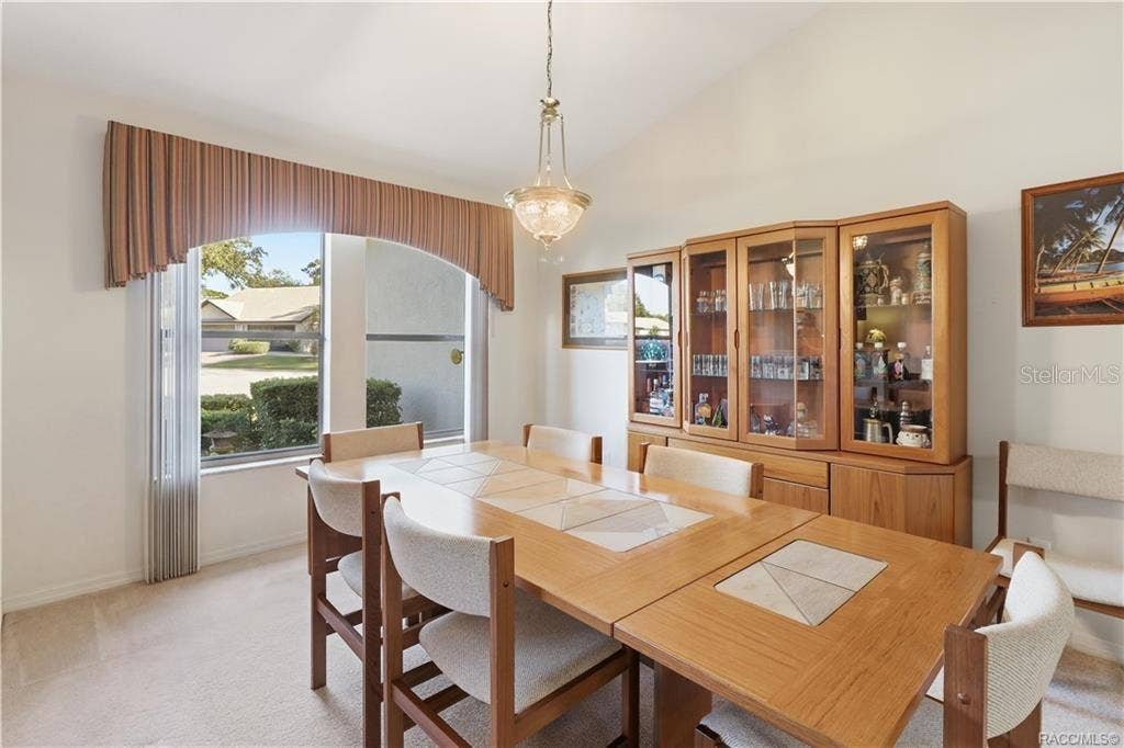6268 W WESTON DRIVE, Crystal River, FL 34429 DINING IN STYLE! Another perspective of the FORMAL DINING ROOM showcases its spacious layout, attractive lighting & natural light!