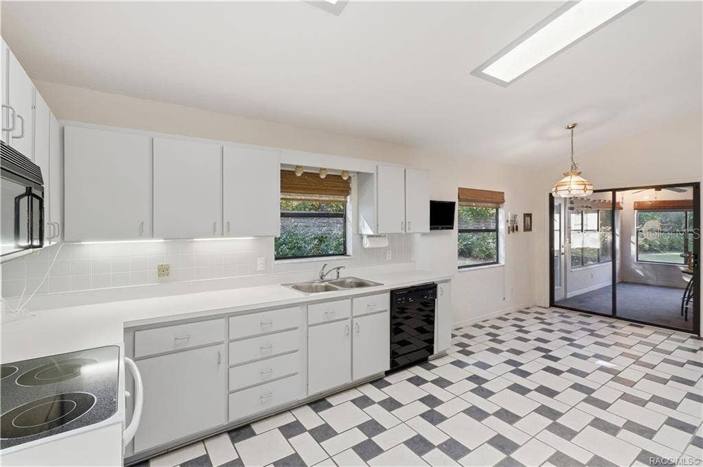 6268 W WESTON DRIVE, Crystal River, FL 34429 A KITCHEN WITH ROOM TO MOVE! Generous countertop space, abundant cabinetry, DOUBLE-BASIN SINK & convenient access to the ENCLOSED FLORIDA ROOM!