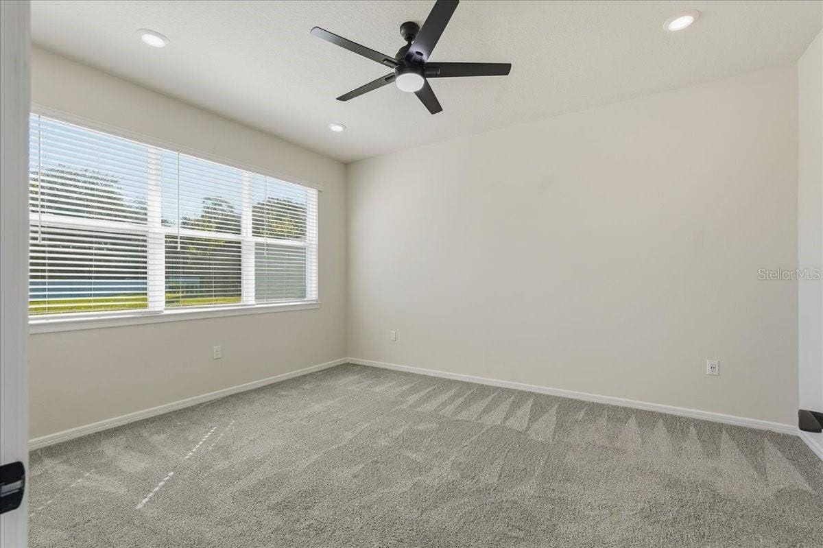 Primary Bedroom with Lighted Ceiling Fan and LED Downlights