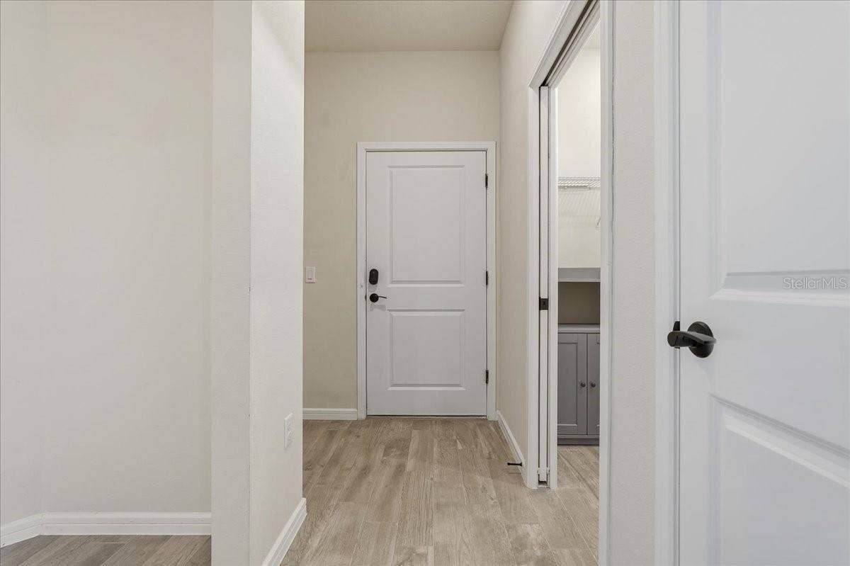 Garage Door Entry - Laundry Room on right with pocket door