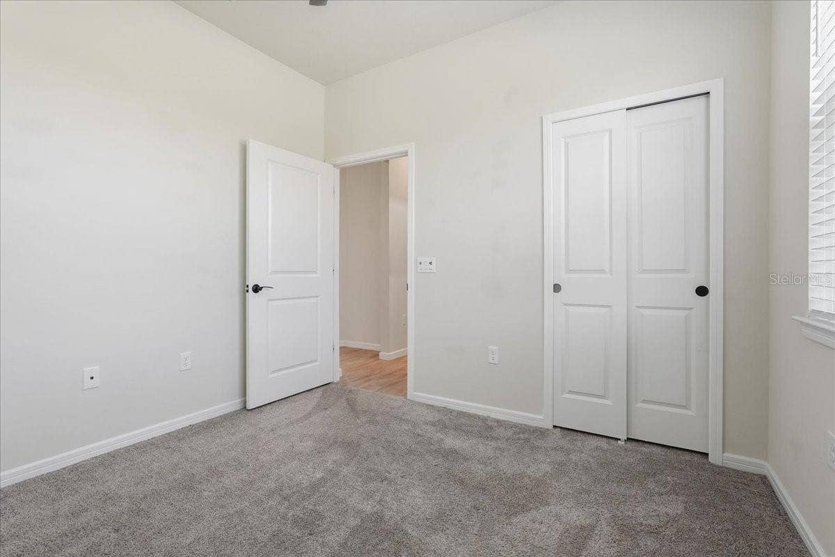 Bedroom 2 with Lighted Ceiling Fan