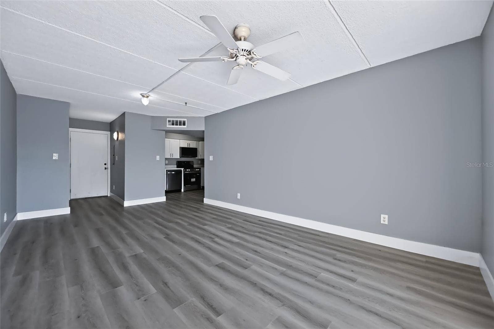 10365 PARADISE BOULEVARD, #5, Treasure Island, FL 33706 Living Room/ Dining and Kitchen