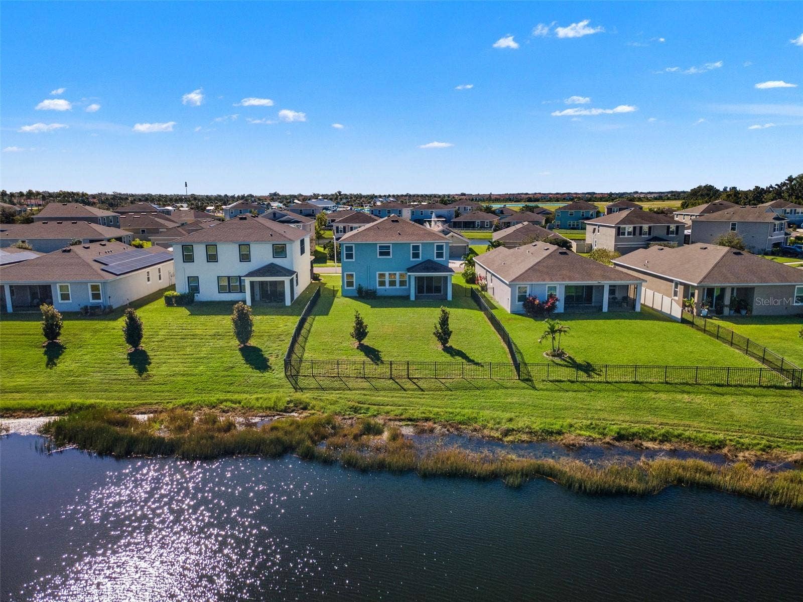 Rear aerial and pond-side yard - 5126 Jackel Chase Dr, Wimauma