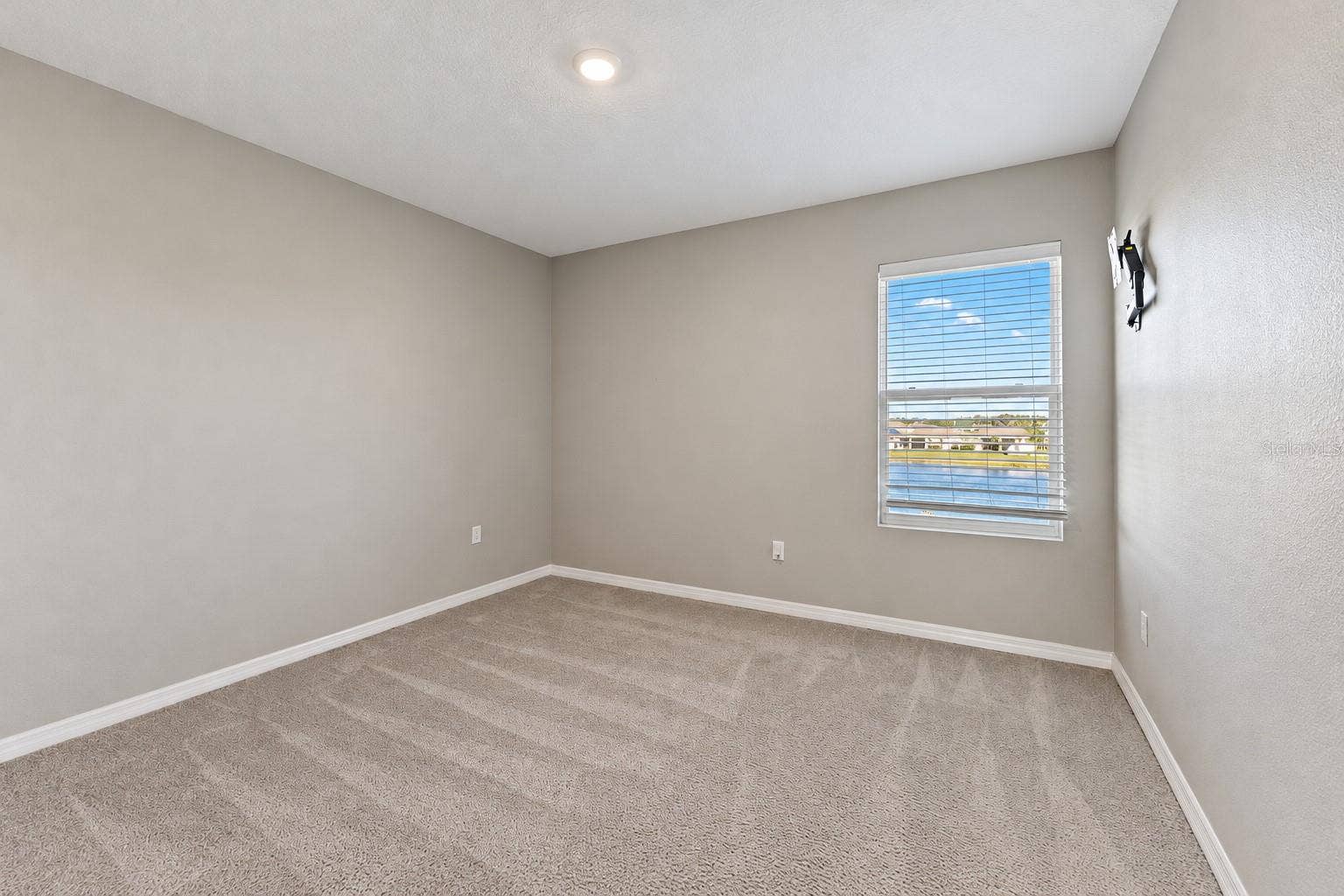 Secondary bedroom pond-facing window - 5126 Jackel Chase Dr, Wimauma