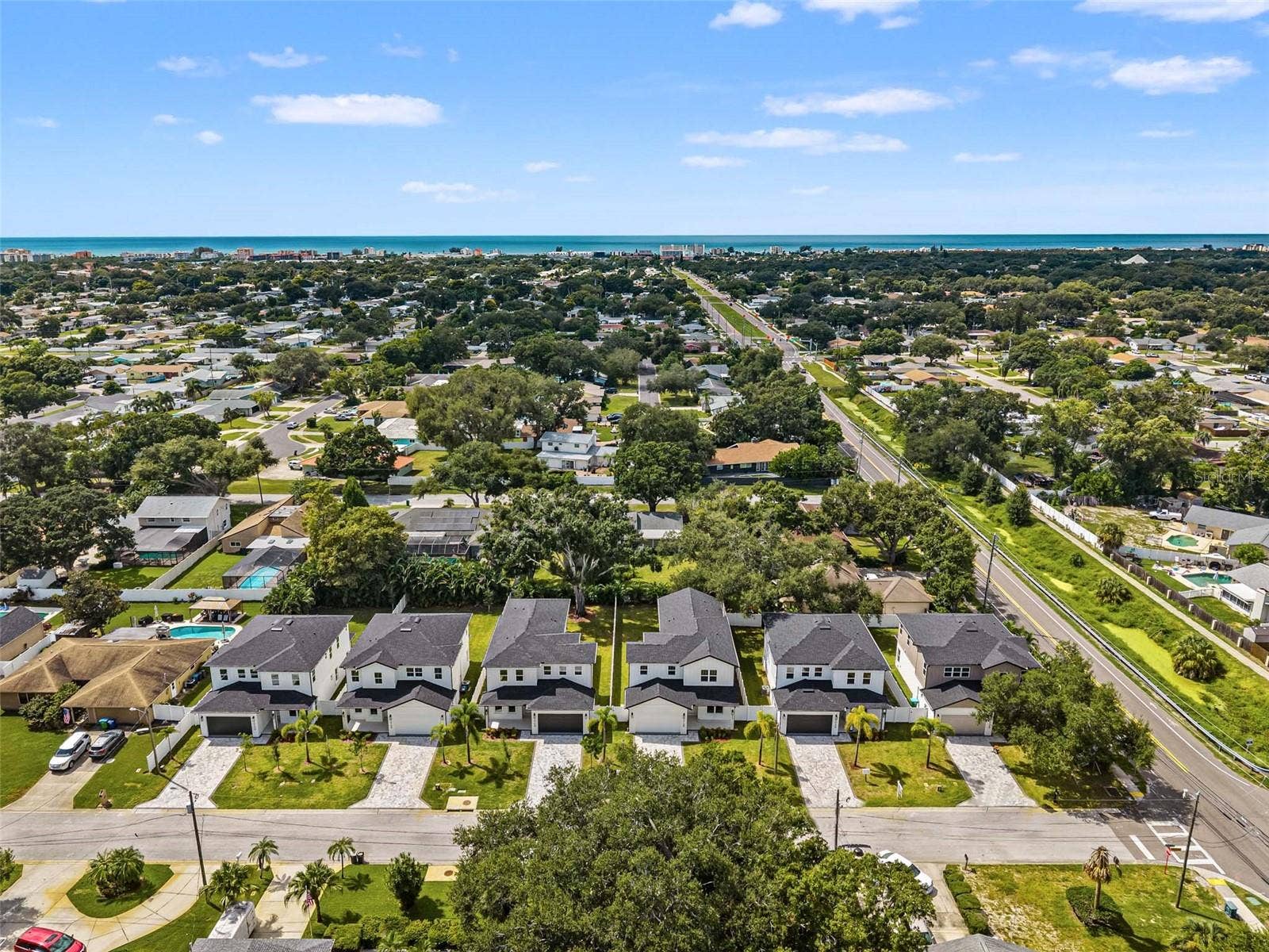 10144 HODSON PLACE, Seminole, FL 33776 aerial view of all homes with the beach in the distance