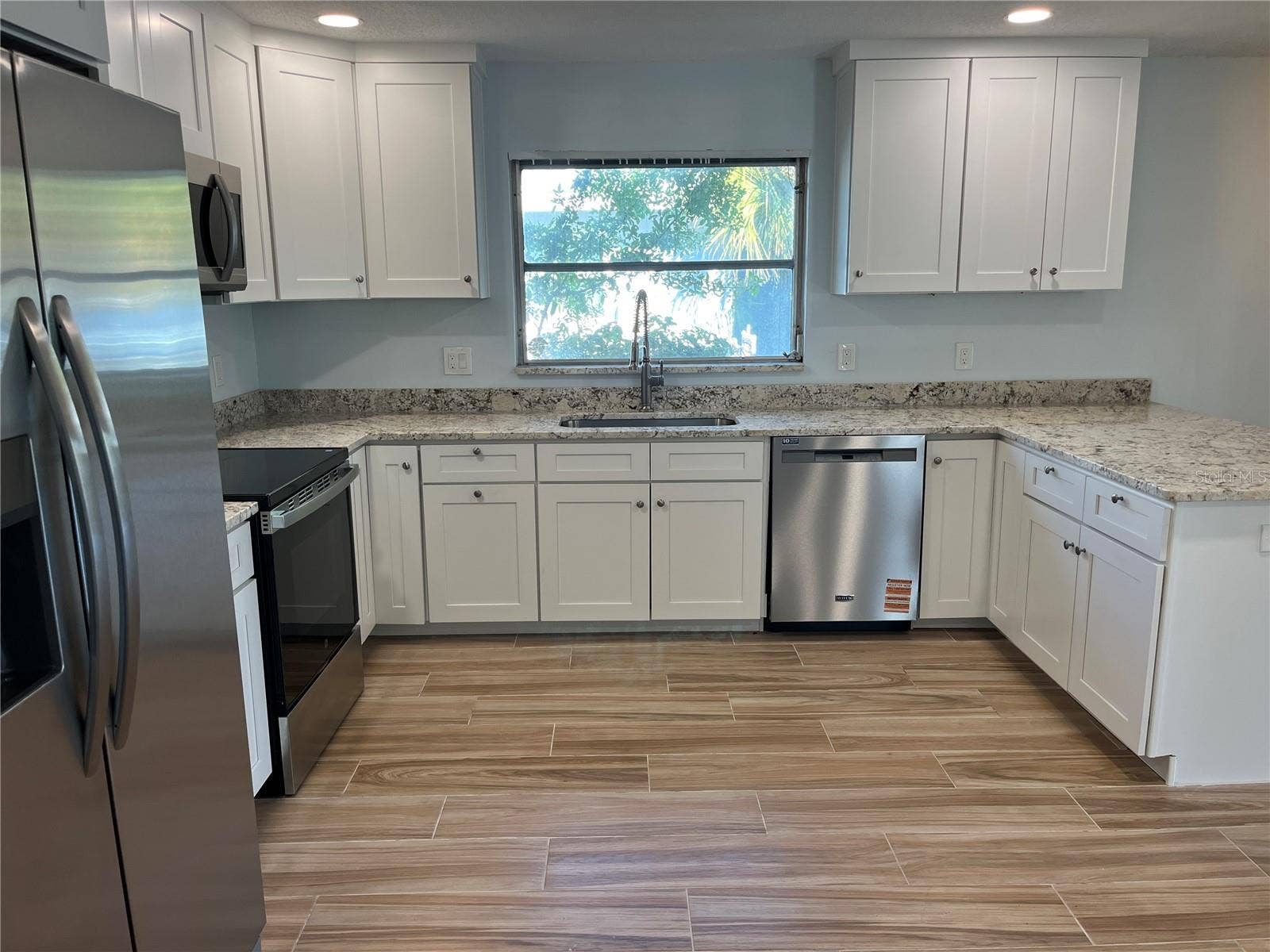 307 LA HACIENDA DRIVE, Indian Rocks Beach, FL 33785 Lovely open kitchen with natural lighting