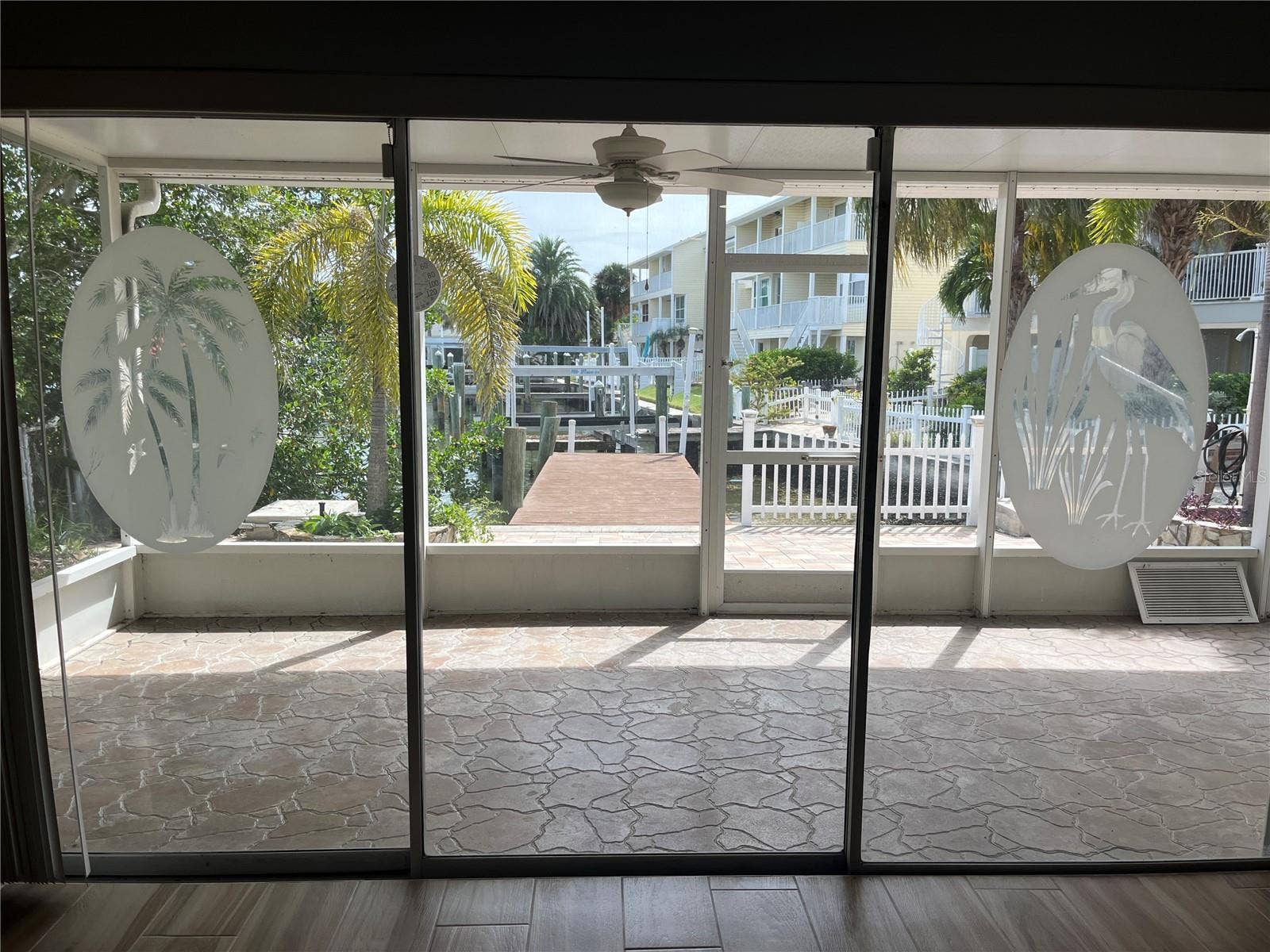 307 LA HACIENDA DRIVE, Indian Rocks Beach, FL 33785 Decorative sliding doors to the covered outside patio