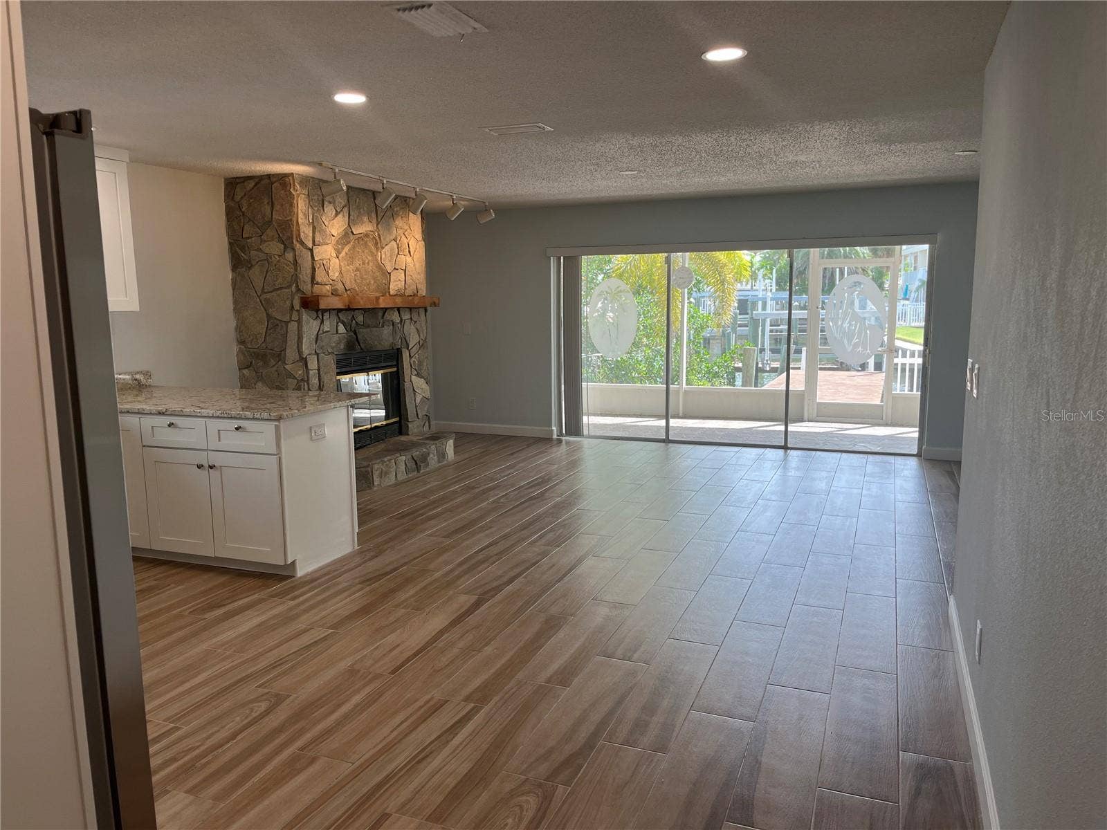 307 LA HACIENDA DRIVE, Indian Rocks Beach, FL 33785 Entrance into the living area with fireplace
