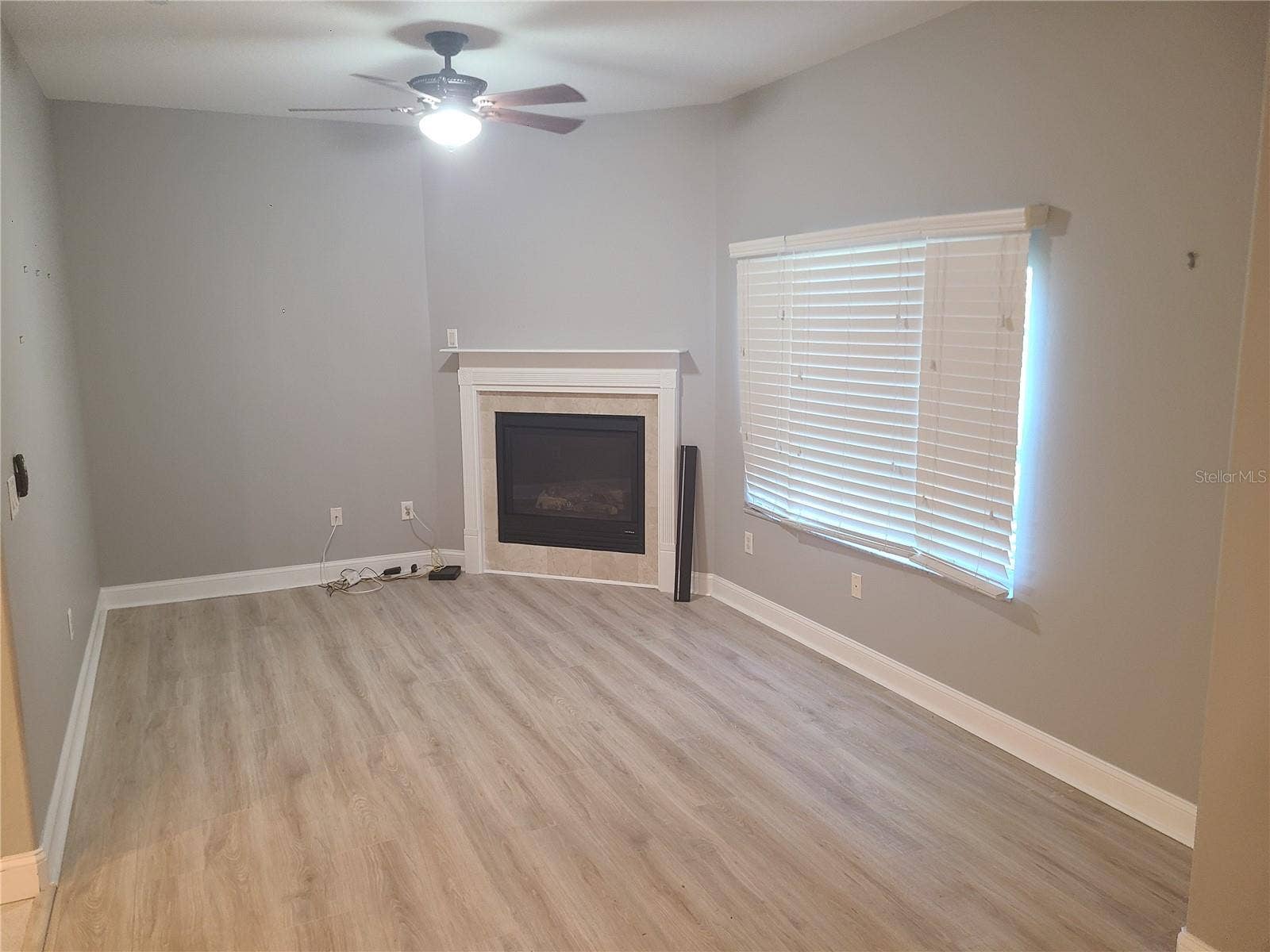 6517 SAND SHORE LANE, New Port Richey, FL 34652 Second Floor Living Room with Gas Burning Fireplace