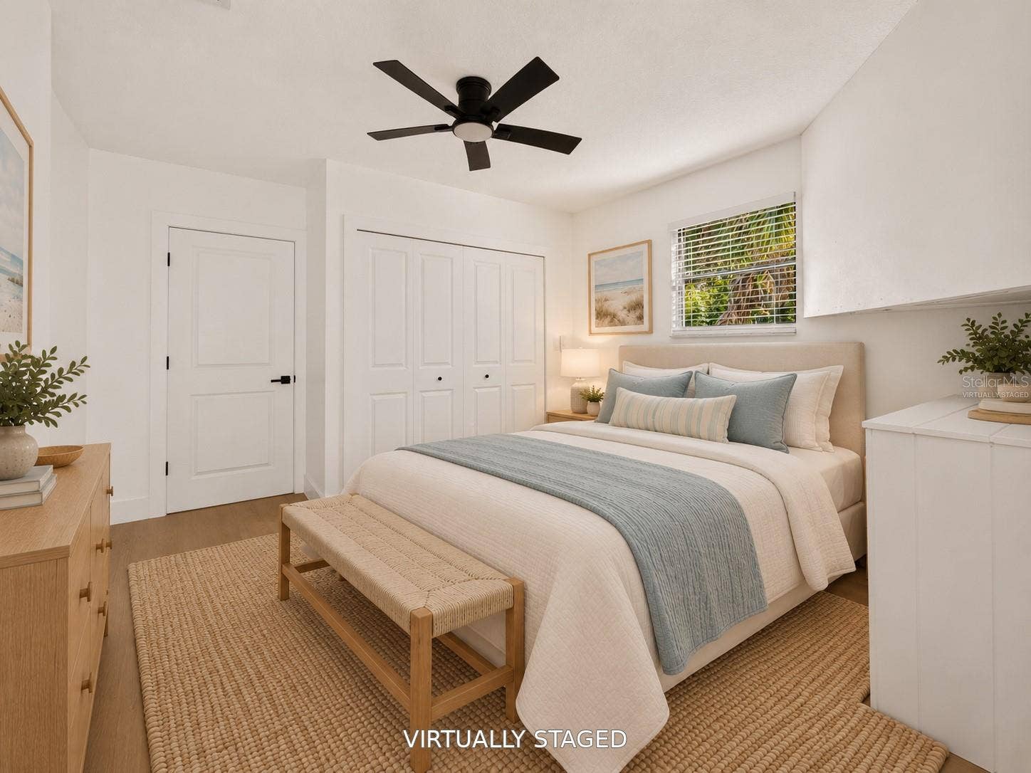 16107 SEA PINES DRIVE, Hudson, FL 34667 VIRTUALLY STAGED. Additional bedroom featuring a sleek black ceiling fan and updated flooring.