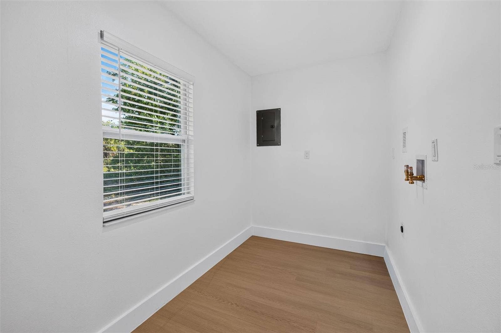 16107 SEA PINES DRIVE, Hudson, FL 34667 Convenient laundry room off the primary bedroom offers additional storage space.