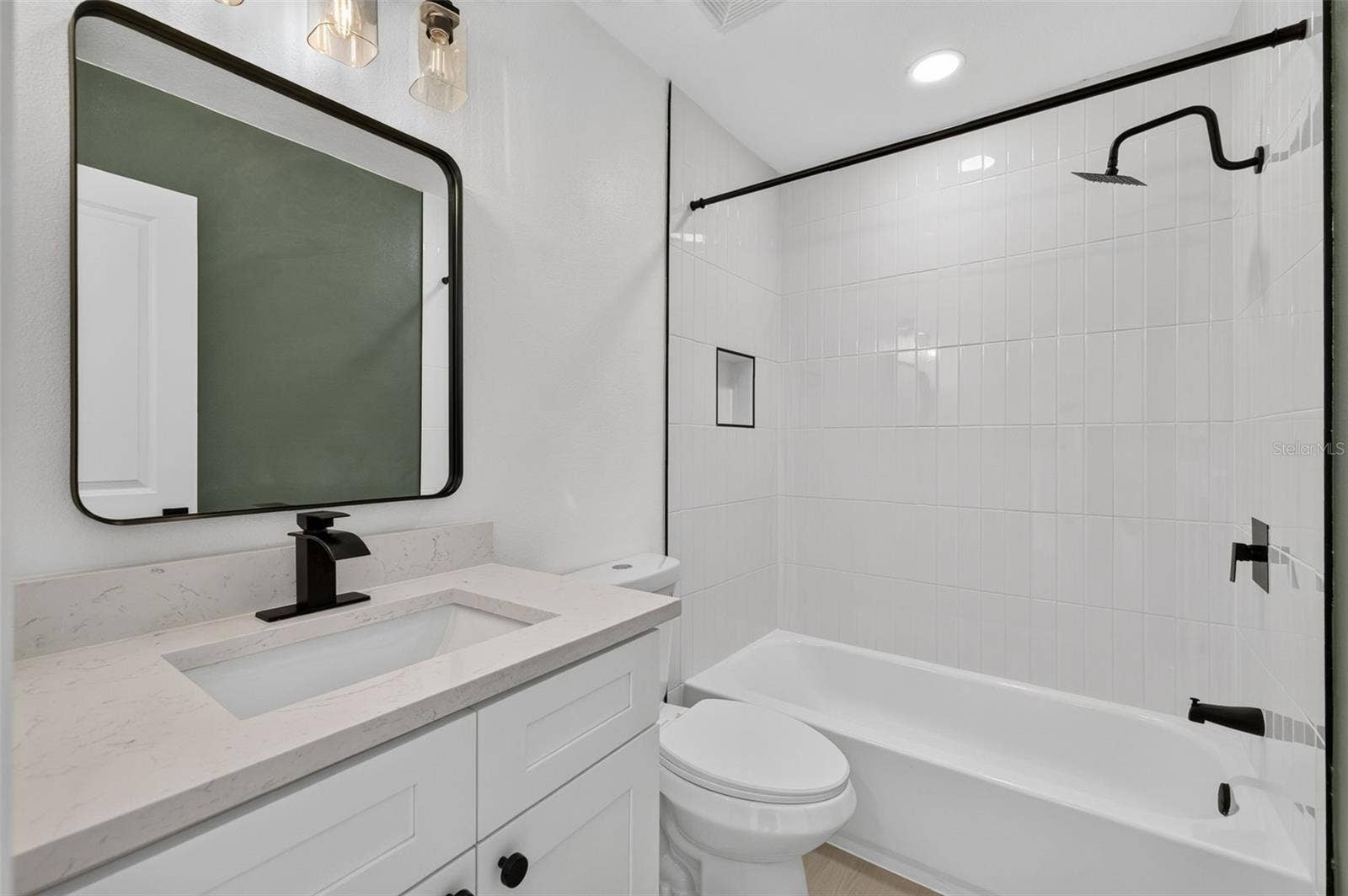 16107 SEA PINES DRIVE, Hudson, FL 34667 Conveniently located guest bathroom with a clean, functional layout.